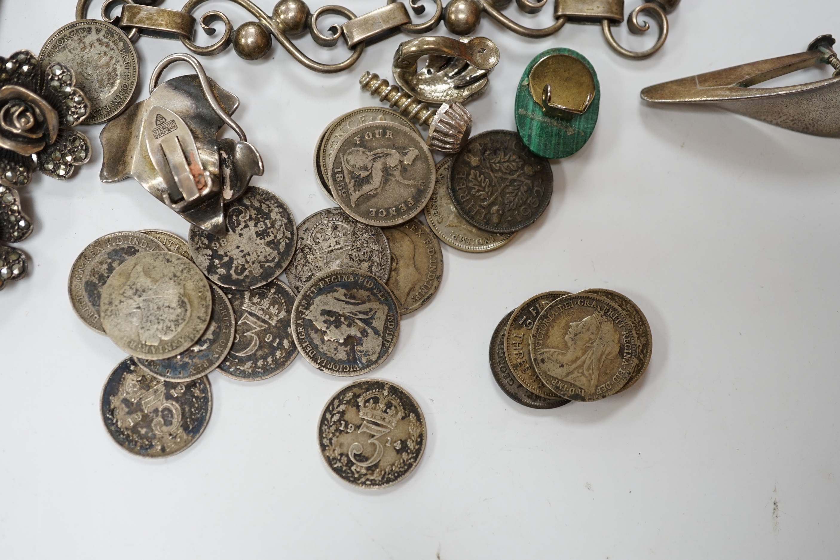 A quantity of assorted jewellery including costume, a pair of Danish sterling ear clips, a 1960's Nanna & Jorgen Ditzel for Georg Jensen sterling silver brooch, no.328, 51mm, a pair of Georg Jensen sterling ear clips, no